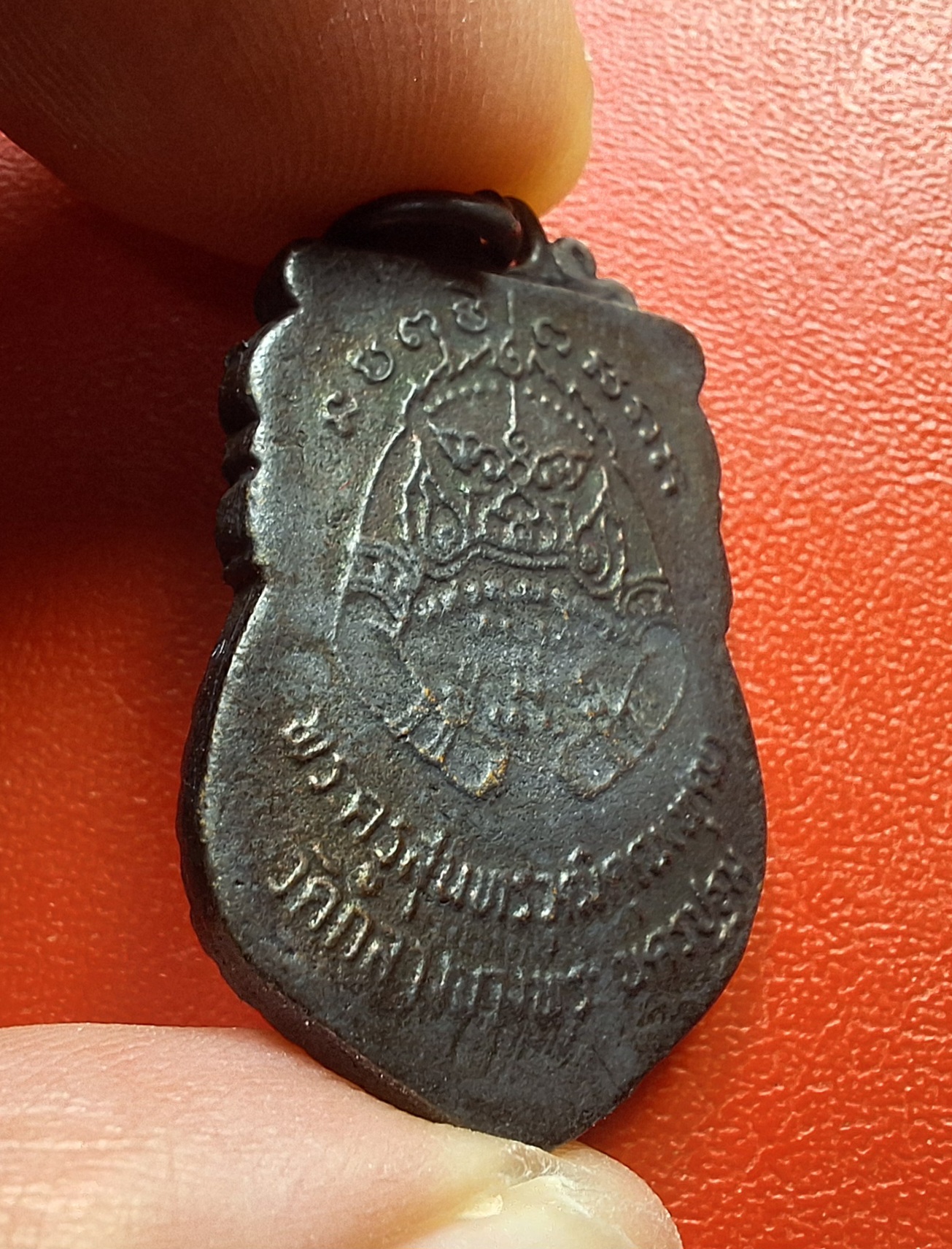 หลวงพ่อพุฒ วัดกลางบางพระ เหรียญหล่อนั่งปืน เนื้อทองแดง(องค์ที่2)