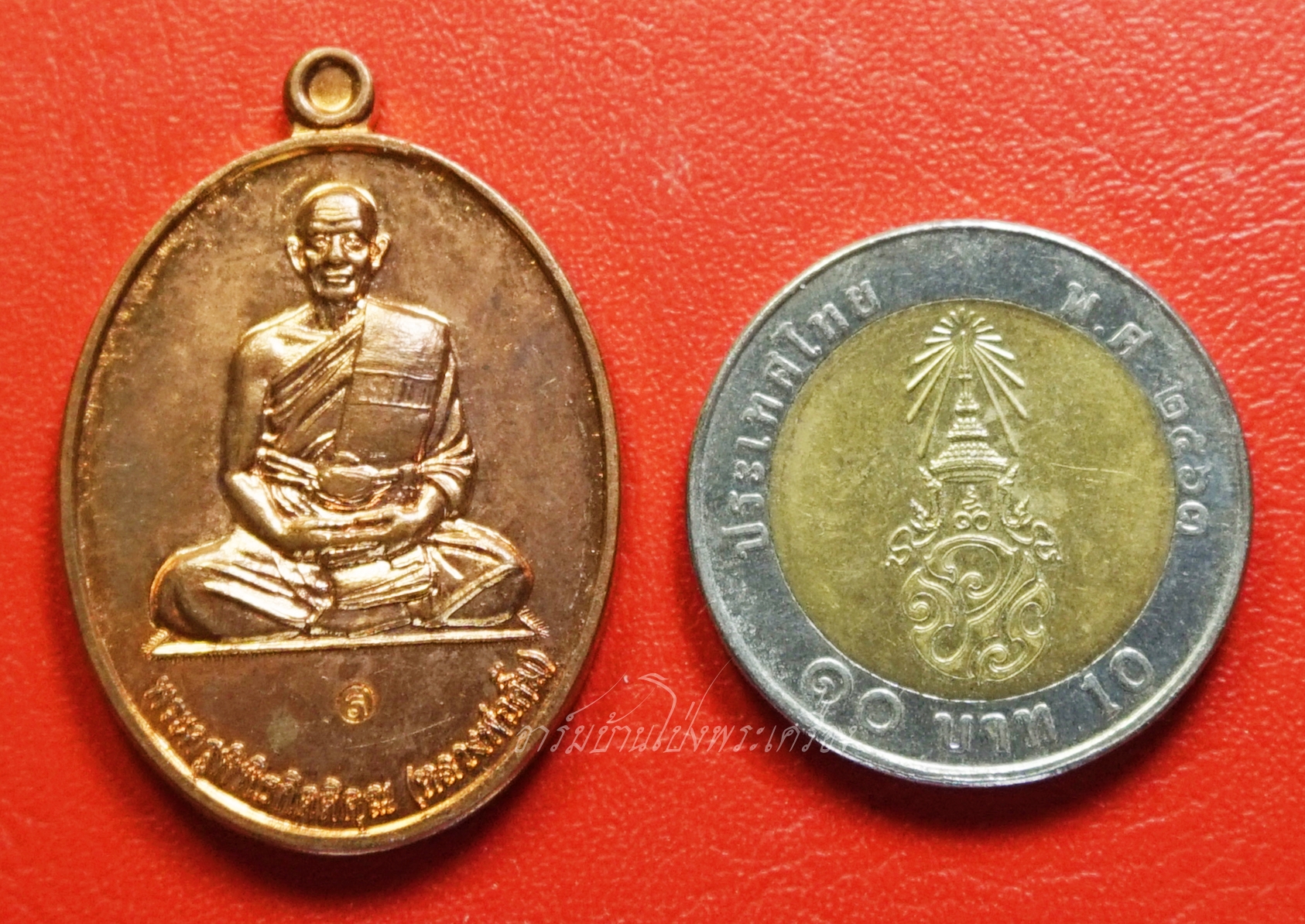 หลวงพ่อคิ้ม วัดหนองเสือ อายุครบ๘๕ปี ปี๒๕๕๕ เนื้อทองแดงผิวไฟ(องค์ที่1)