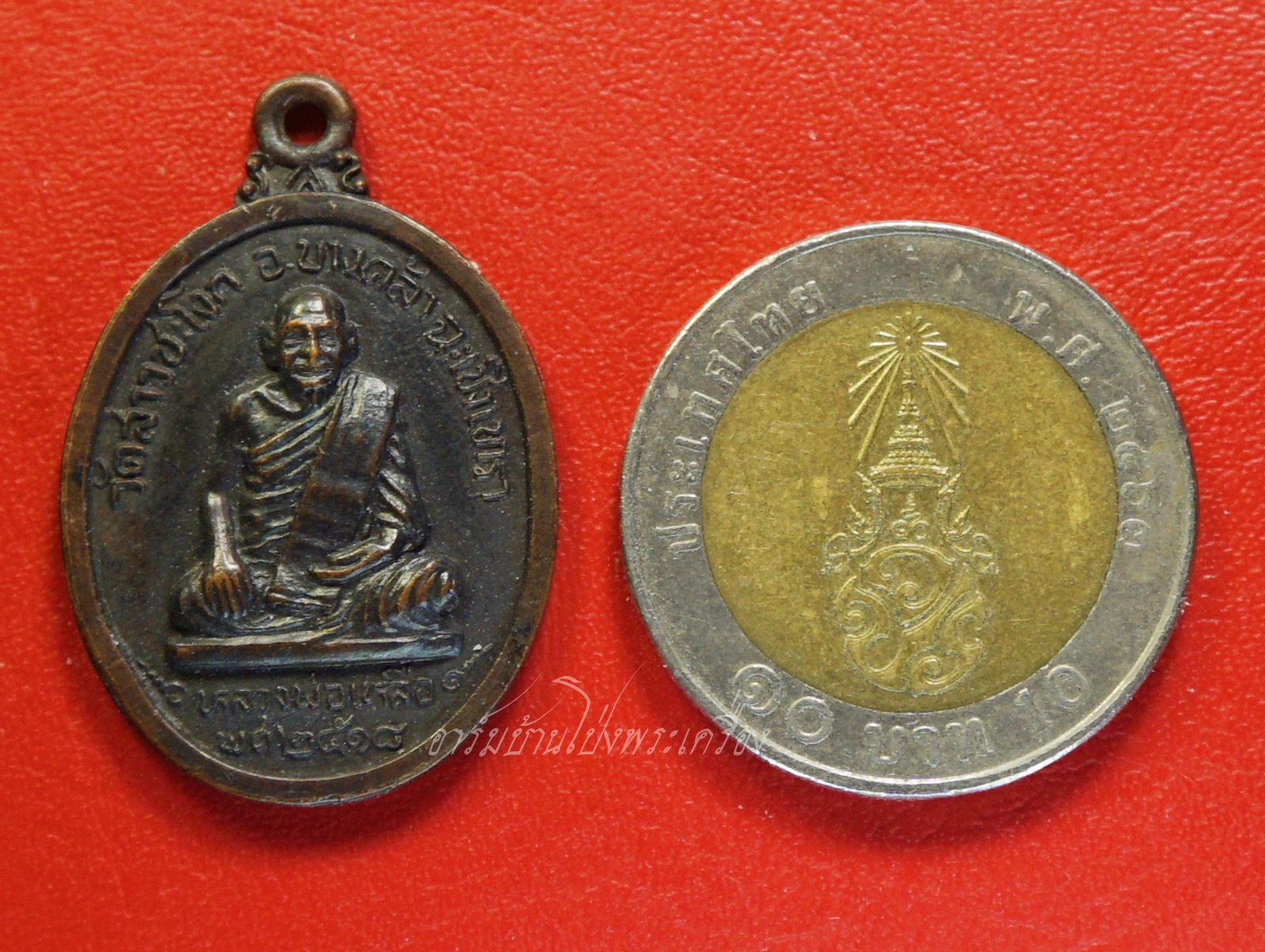 หลวงพ่อเหลือ วัดสาวชะโงก จ.ฉะเชิงเทรา รุ่นลาภผลพูนทวี ปี๑๘ เนื้อทองแดงรมดำ(องค์ที่1)