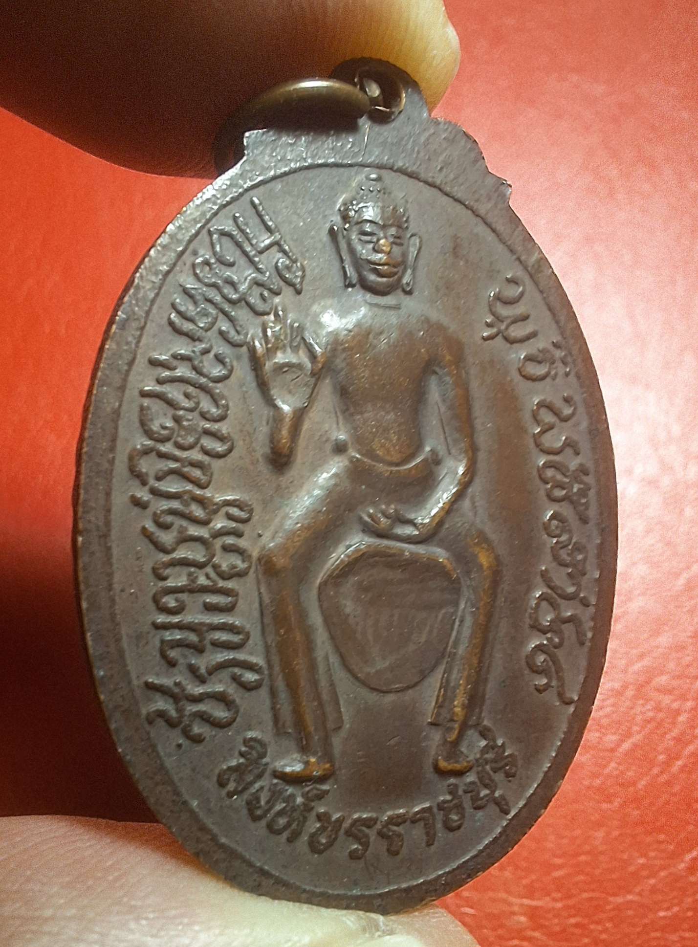 หลวงพ่อถมยา พรหมโชโตภิกขุ วัดถ้ำเขางู ด้านหลังสิงห์ขร รุ่นแรก เนื้อทองแดงรมดำ(องค์ที่3)