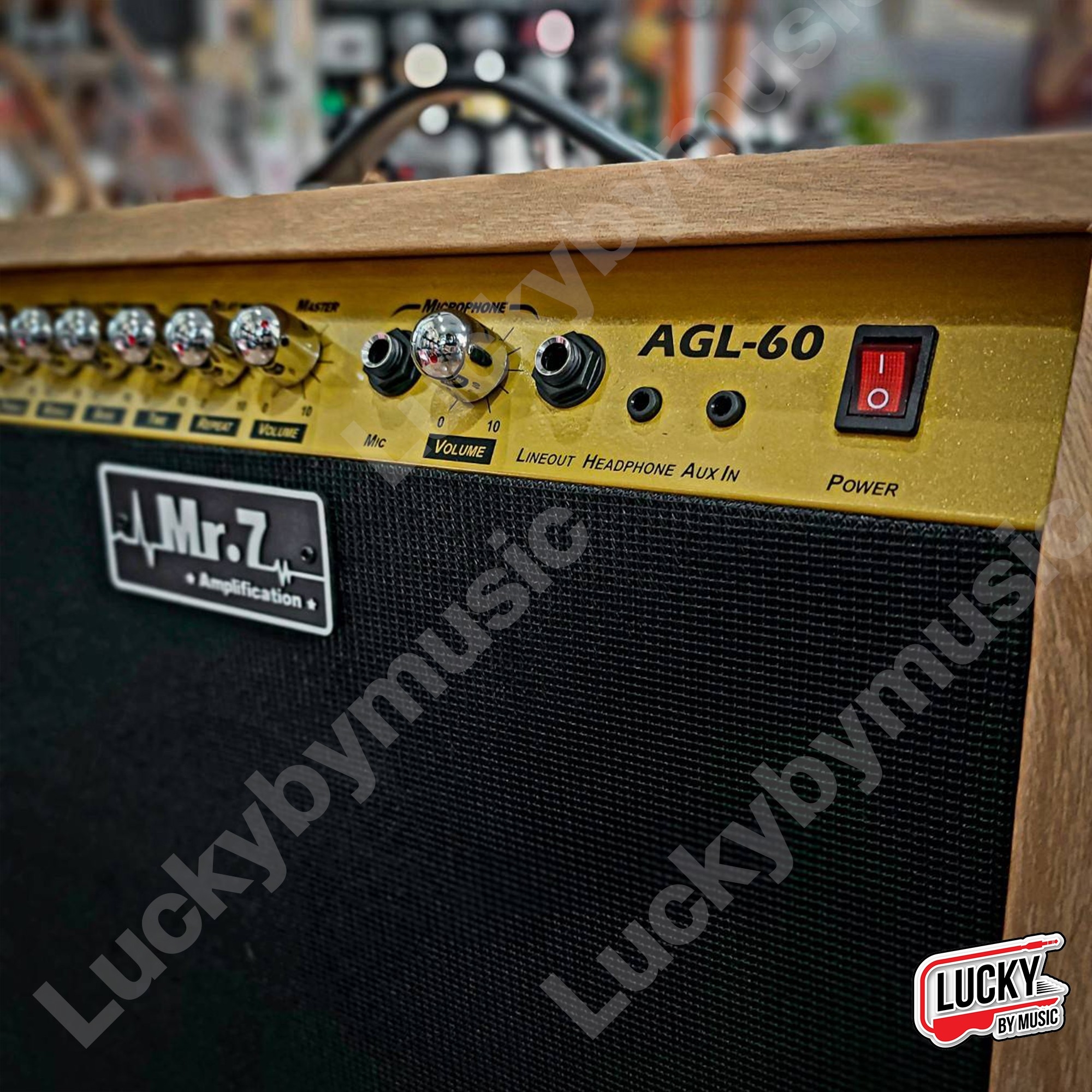 แอมป์กีต้าร์ไฟฟ้า Mr.7 รุ่น AGL-60 สีดำ/ไม้ สีไม้ กำลังขับ 60 วัตต์เต็ม ดอกลำโพง 10 นิ้ว มีเสียงแตก พร้อมเอฟเฟคในตัว แอมป์กีตาร์